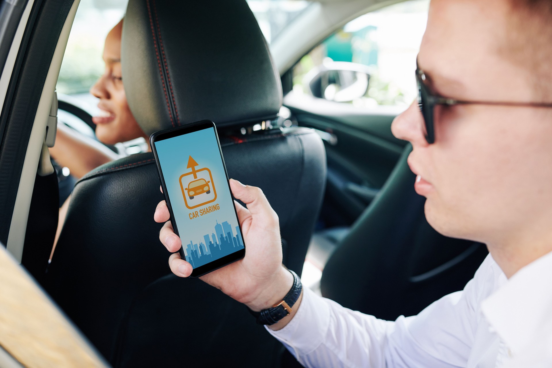 Man using car sharing app